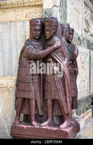 The ancient Portrait of the Four Tetrarchs by the St Mark`s Square in Venice, Italy. It is a porphyry sculpture group of Roman emperors dating from ar Stock Photo